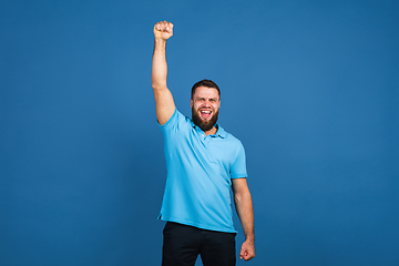 Image showing Caucasian man\'s portrait isolated on blue studio background with copyspace