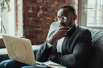 Image showing Businessman or student working from home while being isolated or keep quarantine \'cause of coronavirus COVID-19