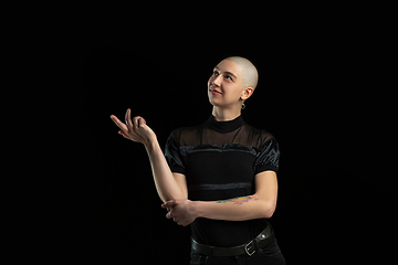 Image showing Monochrome portrait of young caucasian bald woman on black background