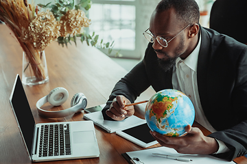 Image showing Businessman or student working from home while being isolated or keep quarantine \'cause of coronavirus COVID-19