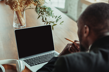 Image showing Businessman or student working from home while being isolated or keep quarantine \'cause of coronavirus COVID-19