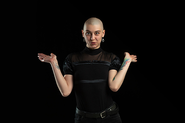 Image showing Monochrome portrait of young caucasian bald woman on black background