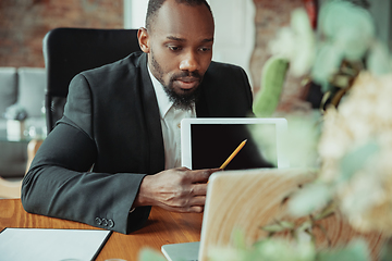 Image showing Businessman or student working from home while being isolated or keep quarantine \'cause of coronavirus COVID-19