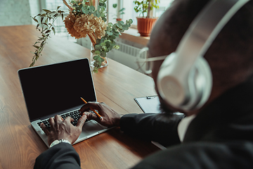 Image showing Businessman or student working from home while being isolated or keep quarantine \'cause of coronavirus COVID-19