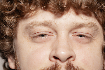 Image showing Close up of face of beautiful caucasian young man, focus on eyes