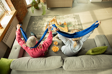 Image showing Excited family watching football, sport match at home, grandma and daughter