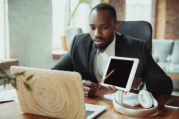 Image showing Businessman or student working from home while being isolated or keep quarantine \'cause of coronavirus COVID-19