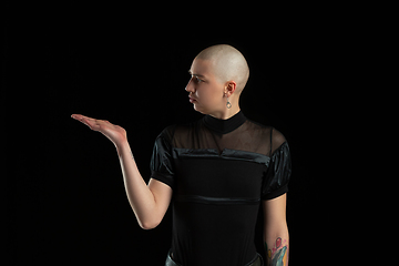 Image showing Monochrome portrait of young caucasian bald woman on black background