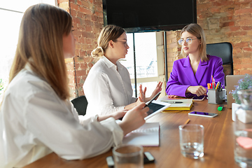 Image showing Business young caucasian woman in modern office with team