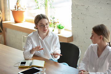 Image showing Young caucasian women working in office, diversity and girl power concept