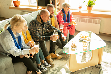 Image showing Excited family watching football, sport match at home