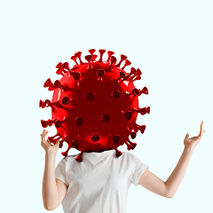 Image showing Woman headed by model of COVID-19 coronavirus, concept of pandemic spreading