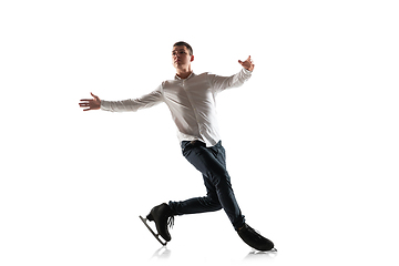 Image showing Man figure skating isolated on white studio backgound with copyspace