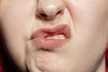 Image showing Close-up female mouth with natural lips make-up. Cosmetology, dentistry and beauty care, human emotions