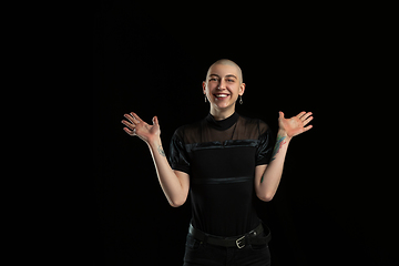 Image showing Monochrome portrait of young caucasian bald woman on black background