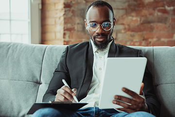 Image showing Businessman or student working from home while being isolated or keep quarantine \'cause of coronavirus COVID-19