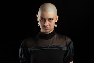 Image showing Monochrome portrait of young caucasian bald woman on black background