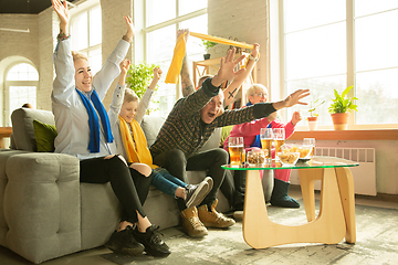 Image showing Excited family watching football, sport match at home