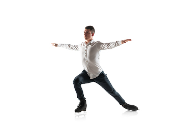 Image showing Man figure skating isolated on white studio backgound with copyspace