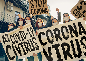 Image showing Young people in face masks protesting of stop coronavirus pandemic on the street