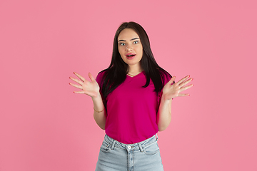 Image showing Monochrome portrait of young caucasian brunette woman on pink background