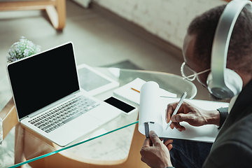 Image showing Top view of businessman or student working from home while being isolated or keep quarantine \'cause of coronavirus COVID-19