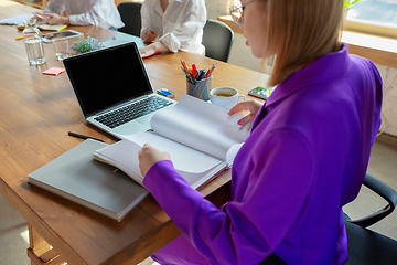 Image showing Business young caucasian woman in modern office with team