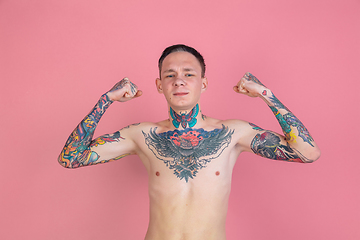 Image showing Portrait of young man with freaky appearance on pink background