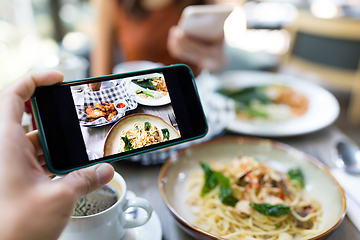 Image showing Taking photo on the food in restaurant