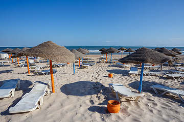 Image showing Beach umbrellas on sandy Tunis beach