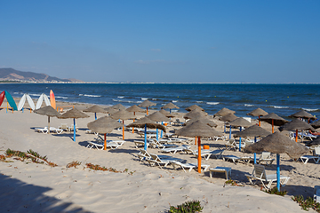 Image showing Beach umbrellas on sandy Tunis beach