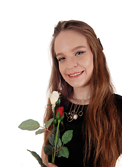 Image showing Beautiful woman in black dress with rose