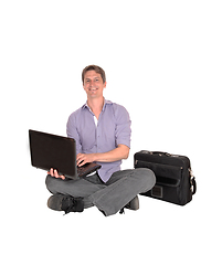 Image showing Man sitting on floor with his laptop