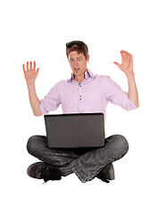 Image showing Scared man what he sees on his laptop