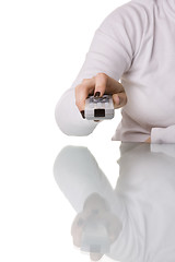 Image showing woman holding a remote control