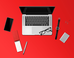 Image showing Office desk mockup top view isolated on red