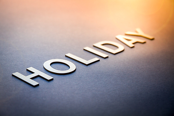 Image showing Word holiday written with white solid letters