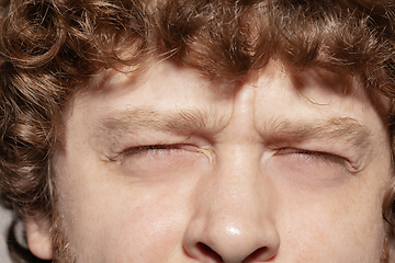 Image showing Close up of face of beautiful caucasian young man, focus on eyes