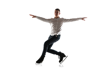 Image showing Man figure skating isolated on white studio backgound with copyspace