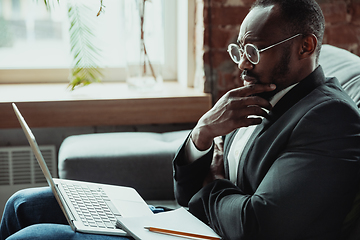 Image showing Businessman or student working from home while being isolated or keep quarantine \'cause of coronavirus COVID-19