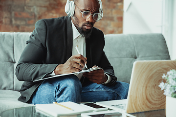 Image showing Businessman or student working from home while being isolated or keep quarantine \'cause of coronavirus COVID-19