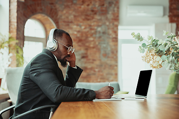 Image showing Businessman or student working from home while being isolated or keep quarantine \'cause of coronavirus COVID-19