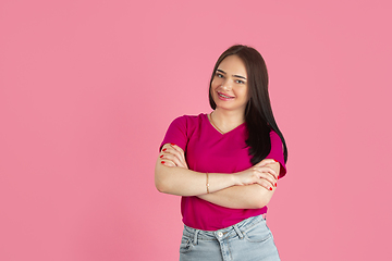 Image showing Monochrome portrait of young caucasian brunette woman on pink background