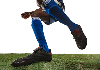 Image showing Football or soccer player on white background - motion, action, activity concept, wide angle