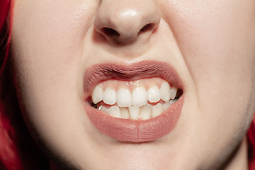 Image showing Close-up female mouth with natural lips make-up. Cosmetology, dentistry and beauty care, human emotions