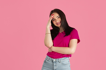 Image showing Monochrome portrait of young caucasian brunette woman on pink background