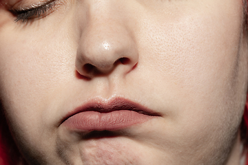 Image showing Close-up female mouth with natural lips make-up. Cosmetology, dentistry and beauty care, human emotions