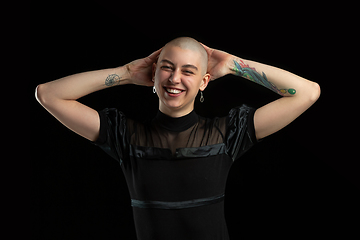 Image showing Monochrome portrait of young caucasian bald woman on black background