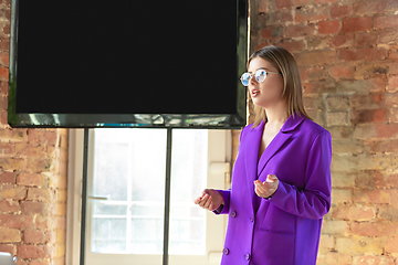 Image showing Young caucasian business woman working in office, diversity and girl power concept