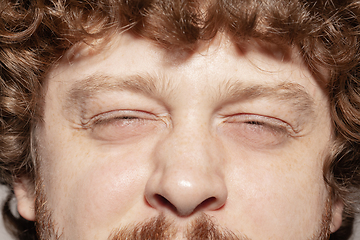 Image showing Close up of face of beautiful caucasian young man, focus on eyes